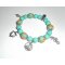 Bracelet en perles de verre turquoise avec perles fleuries sur le thème de la mer