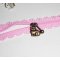 Bracelet original fermeture éclair en dentelle rose avec chat bronze