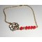 Bracelet rose en filigrane avec cristal de bohème rouge sur chaine plaqué or