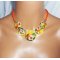 Collier cabochons fleuris oranges en argile polymère sur cordon en coton ciré