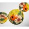 Collier cabochons fleuris oranges en argile polymère sur cordon en coton ciré