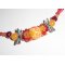 Collier perle fleurie rouge orange avec perles en cristal sur cordon en coton ciré